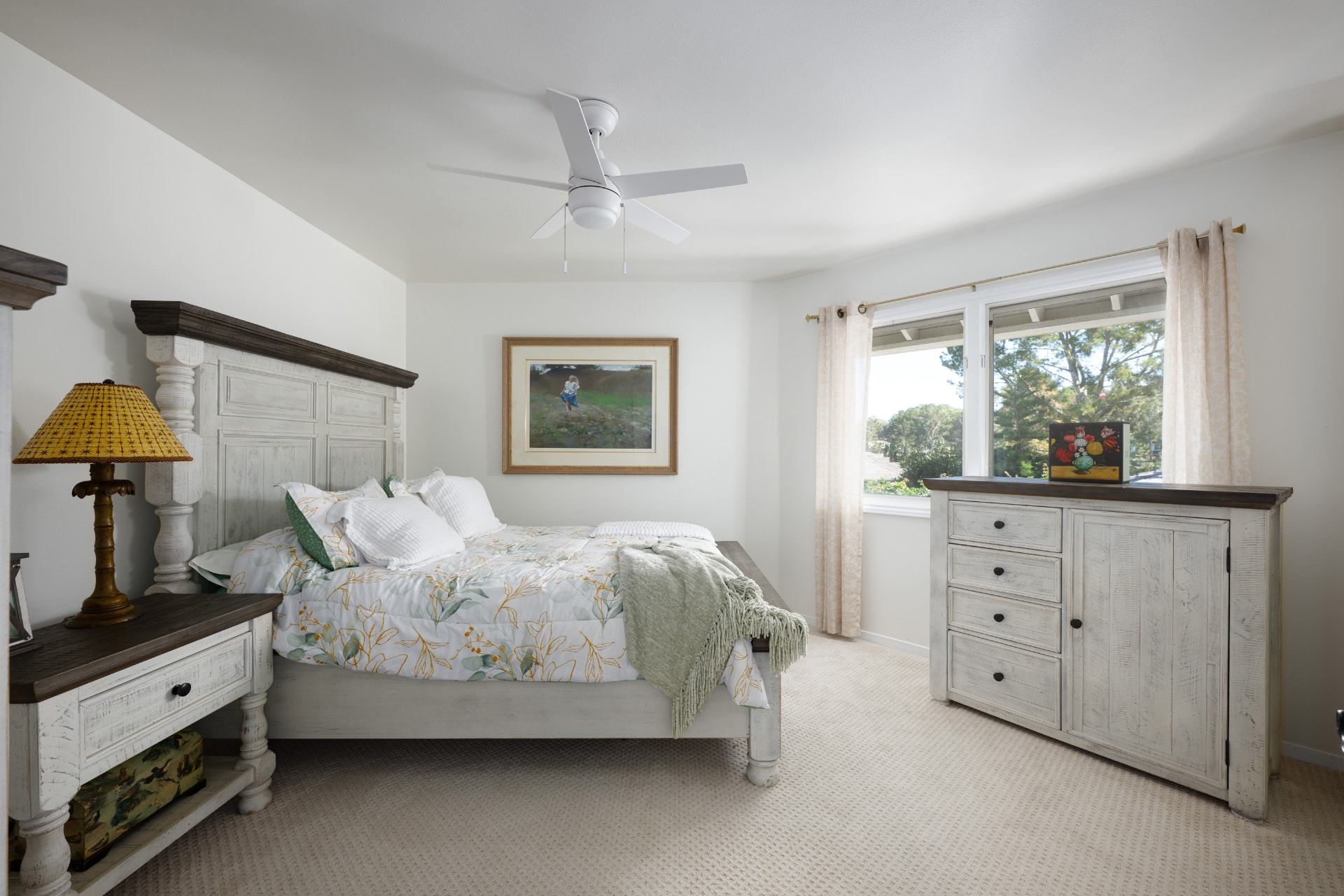 Bedroom with garden window and whitewashed dresser