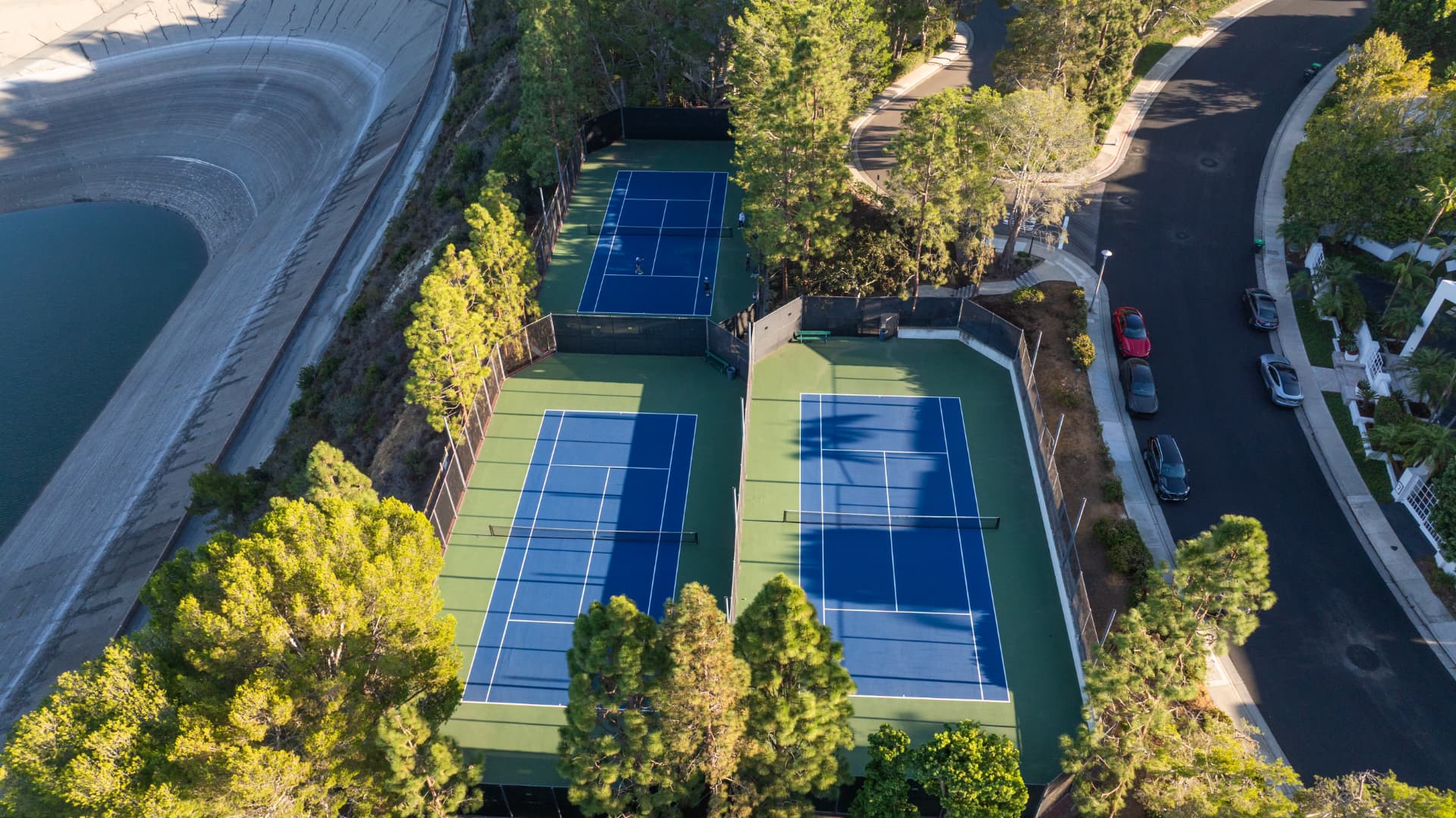 Harbor Ridge community tennis courts and hillside
