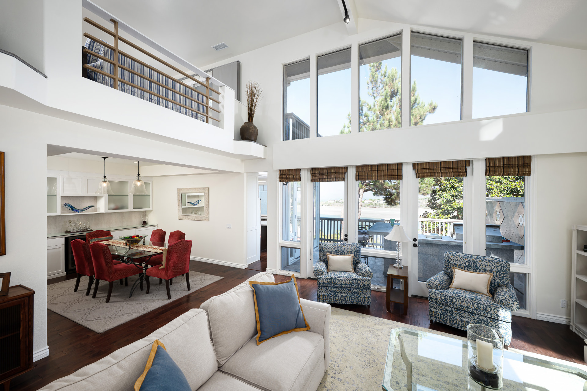 Two-story wall of windows in the great room of 36 Vienna overlooking the San Joaquin Reservoir