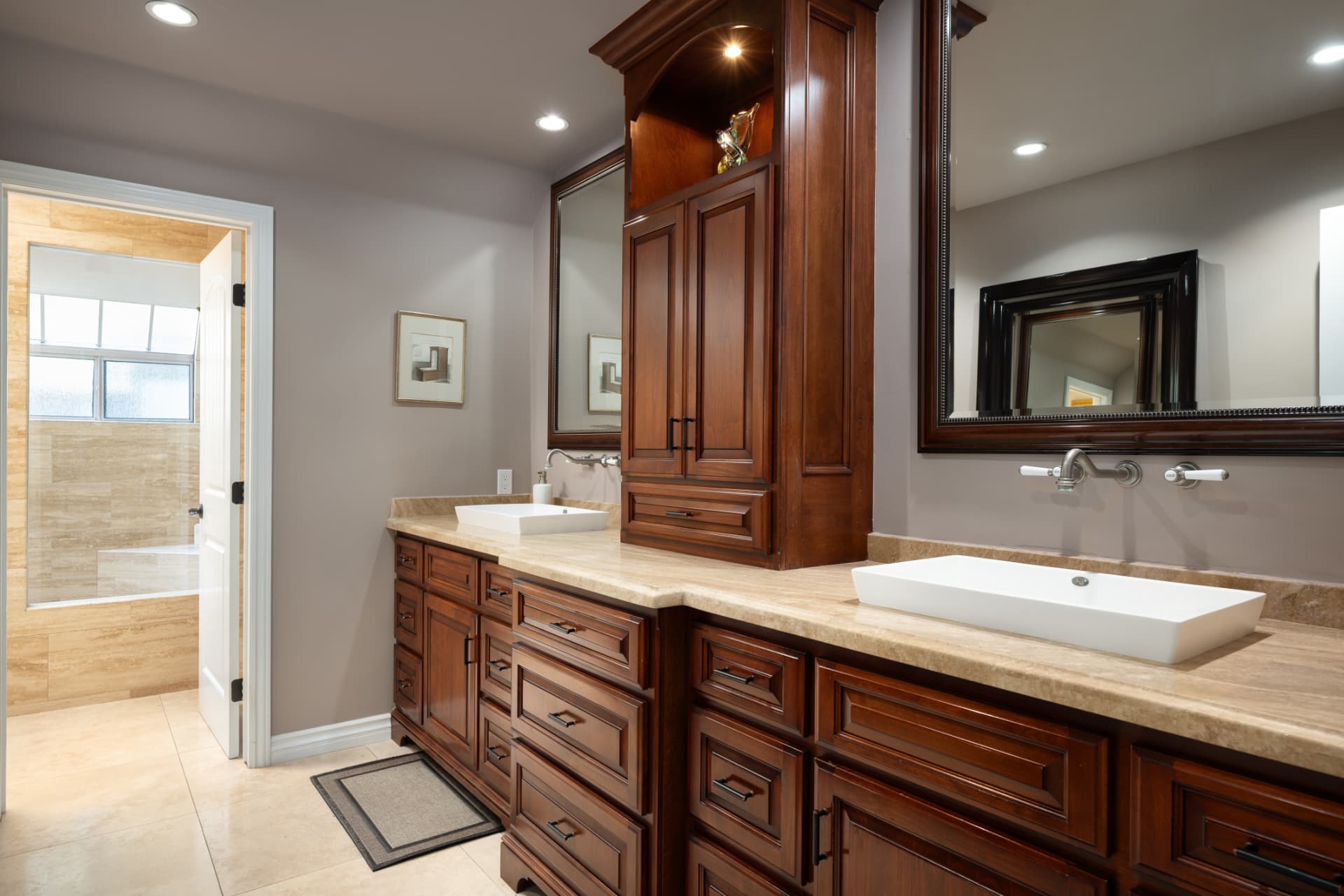 Primary bath with double vanity and travertine counters