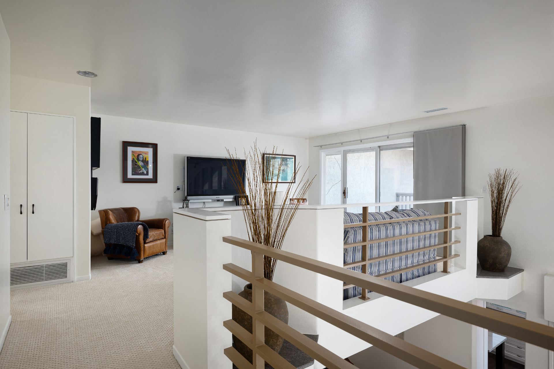 Upstairs loft landing with balcony overlooking the great room